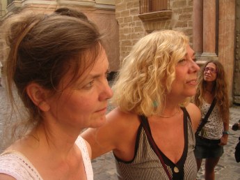 Angelica Westerhoff, portrait artist and painter stands to the left of Carmen de la Torre, painter and animation artist.